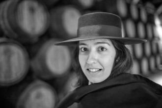 Classic travel guide with student robe, zorro hat and cape, port wine barrels, wine cellar of the