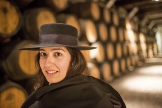 Classic travel guide with student robe, zorro hat and cape, port wine barrels, wine cellar of the
