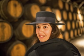 Classic travel guide with student robe, zorro hat and cape, port wine barrels, wine cellar of the