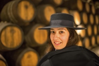 Classic travel guide with student robe, zorro hat and cape, port wine barrels, wine cellar of the