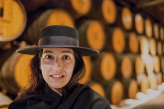 Classic travel guide with student robe, zorro hat and cape, port wine barrels, wine cellar of the