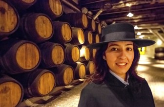 Classic travel guide with student robe, zorro hat and cape, port wine barrels, wine cellar of the