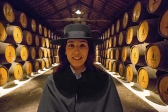 Classic travel guide with student robe, zorro hat and cape, port wine barrels, wine cellar of the