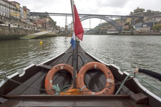Excursion boat trip under the famous bridge of Porto, Ponte de Dom Luis I, Oporto, Porto district,