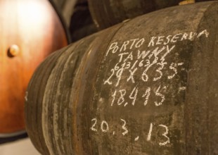 Vintage labelling, port wine barrels, wine cellar of the Sandemann winery in Gaia, Porto, Vila Nova