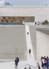 Penitents slide on their knees across the forecourt of the Basilica of Fatima, Fátima, District of