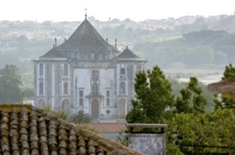 Picturesque small town of Obidos, view of the church in front of the city walls of Óbidos, Leiria