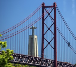 The 113 metre high Cristo-Rei statue of Christ, erected in 1959, photographed through the Puente 25