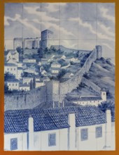 Azelejos, painted tiles with the city motif of the city wall and Obidos Castle, picturesque small