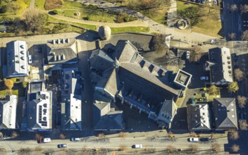Aerial view, catholic church St. Martinus, town wall with angel tower, vertical shot, Olpe town,