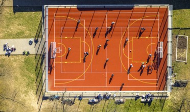 Aerial view, red football pitch at the Georg-Müller-Schule comprehensive school with pupils, shapes