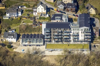 Aerial view, construction site and new construction flats with balconies, castle domicile in