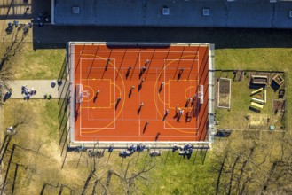 Aerial view, red football pitch at the Georg-Müller-Schule comprehensive school with pupils, shapes
