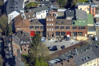 Aerial view, old fire station with tower on the main street, planned redesign for residential area,