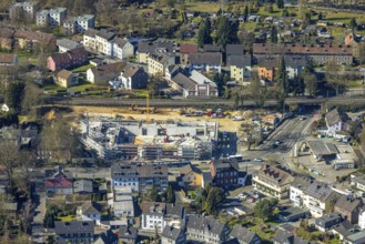 Aerial view, construction site with new building shopping centre Rewe supermarket,