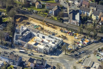 Aerial view, construction site with new building shopping centre Rewe supermarket,