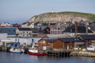 Fishing boats in the harbour, Vardø fyr on the island of Hornøya, lighthouse, Vardø, Finnmark,