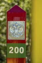 Border Norway-Russia, border posts, yellow border post Norway, red-green border post Russia,