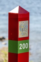 Border Norway-Russia, border posts, yellow border post Norway, red-green border post Russia,