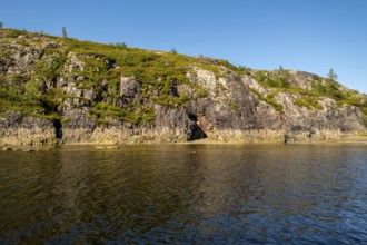 Rocky coast, cave entrance, bowøynes, Finnmark, Norway, Scandinavia, Europe, adventure trip,