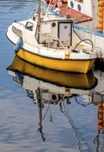 Fishing boat with reflection in the harbour of Honningsvåg, Finnmark, Norway, Scandinavia, Europe,