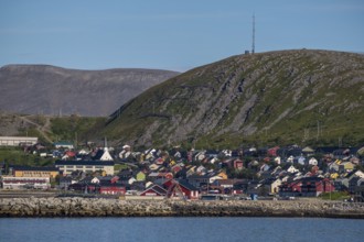 View of village with church in front of mountain range, Kjøllefjord, Finnmark, Norway, Scandinavia,