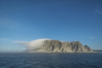 Island in the fog, Kjøllefjord, Finnmark, Norway, Scandinavia, Europe, adventure travel, tourism,