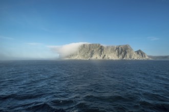 Island in the fog, Kjøllefjord, Finnmark, Norway, Scandinavia, Europe, adventure travel, tourism,