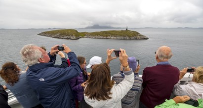 Arctic Circle Globe, Polar Circle Globe, Vikingen Island, photographing tourists, Tonnes, Nordland,
