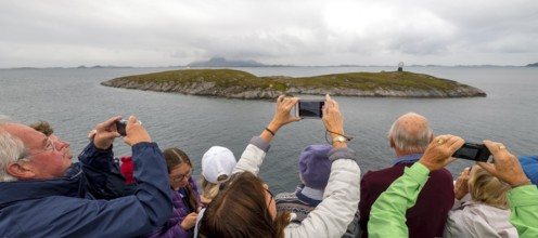 Arctic Circle Globe, Polar Circle Globe, Vikingen Island, photographing tourists, Tonnes, Nordland,