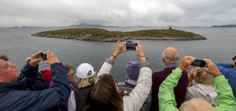 Arctic Circle Globe, Polar Circle Globe, Vikingen Island, photographing tourists, Tonnes, Nordland,