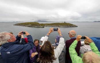 Arctic Circle Globe, Polar Circle Globe, Vikingen Island, photographing tourists, Tonnes, Nordland,