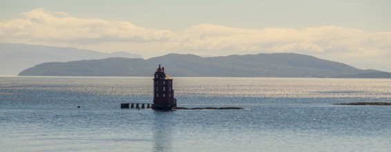 Kjeungskjær Fyr, red lighthouse, off the Norwegian coast on a small archipelago off Ã˜rland,