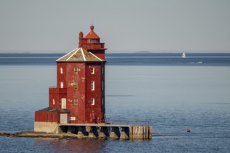 Kjeungskjær Fyr, red lighthouse, off the Norwegian coast on a small archipelago off Ã˜rland,