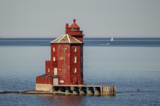 Kjeungskjær Fyr, red lighthouse, off the Norwegian coast on a small archipelago off Ã˜rland,