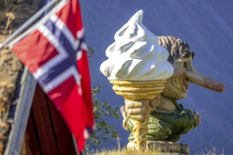 Norwegian troll with ice cream and Norwegian flag, Innfjorden, Møre og Romsdal, Norway,