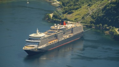 GeirangerFjord, view of Geiranger, ship Queen Elizabeth at anchor, Møre og Romsdal, Norway,