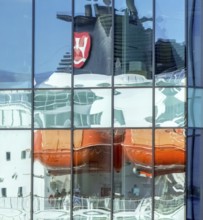 Cruise ship MS Polarlys, reflection, tourists at the quay, Ã...lesund, Møre og Romsdal, Norway,