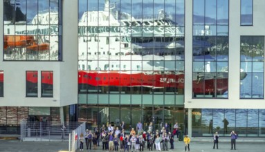 Cruise ship MS Polarlys, reflection, tourists at the quay, Ã...lesund, Møre og Romsdal, Norway,