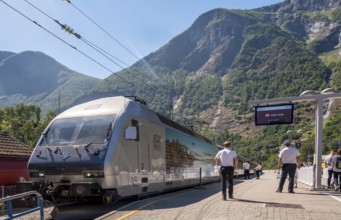 Journey with the Flam Railway, iron railway track, people at the railway track, NSB train, cobbled