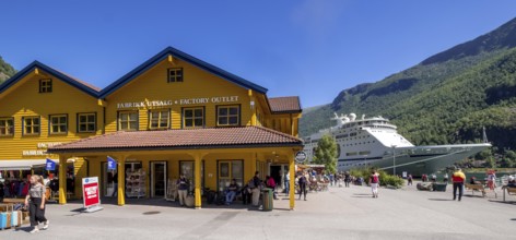 Tourists in Flåm, FABRIK KUTSALG FACTORY OUTLET, shops, yellow wooden house, excursion boat, fjord,