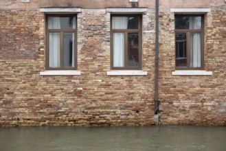Venice, Italy - 2 September 2025: The water in a canal is seen in front of a hotel during the 82nd