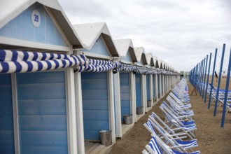 Venice, Italy - 2 September 2025: Beach chairs and cabins on the Lido beach during the 82nd Venice