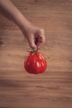 Khinkali tomatoes, on a wooden cutting board, wooden background, no people