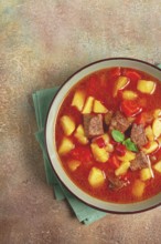 Meat goulash, with potatoes and carrots, sweet pepper, traditional Hungarian soup, homemade, no