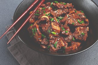 Bulgogi, with mushrooms, with sesame seeds and green onions, Korean cuisine, homemade, no people