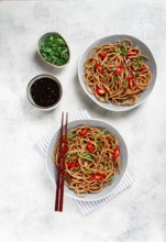 Udon noodles, with shimeji mushrooms, vegetables, in sauce, with sesame seeds, green onions, Asian