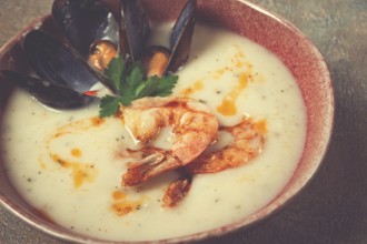 Cream soup, chowder with mussels and shrimp, American cuisine, homemade, no people