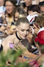 Venice, Italy - 1 September 2025: Amanda Seyfried signing autographs during the Red Carpet of - The