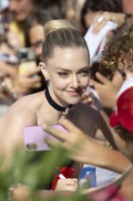 Venice, Italy - 1 September 2025: Amanda Seyfried signing autographs during the Red Carpet of - The